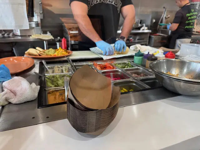 Worker making a wrap at Micheline's Pita House